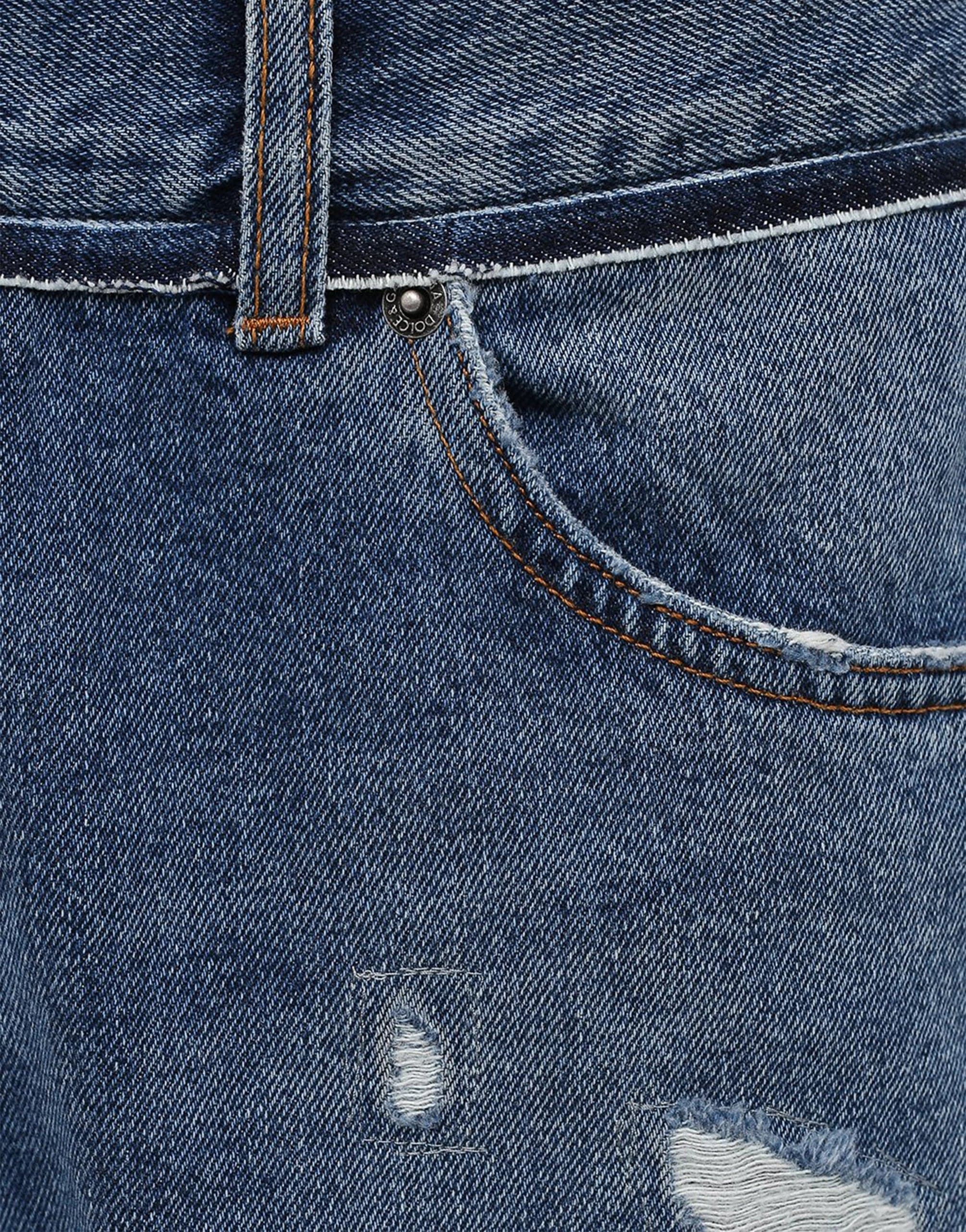 Jeans effetto consumato a strati