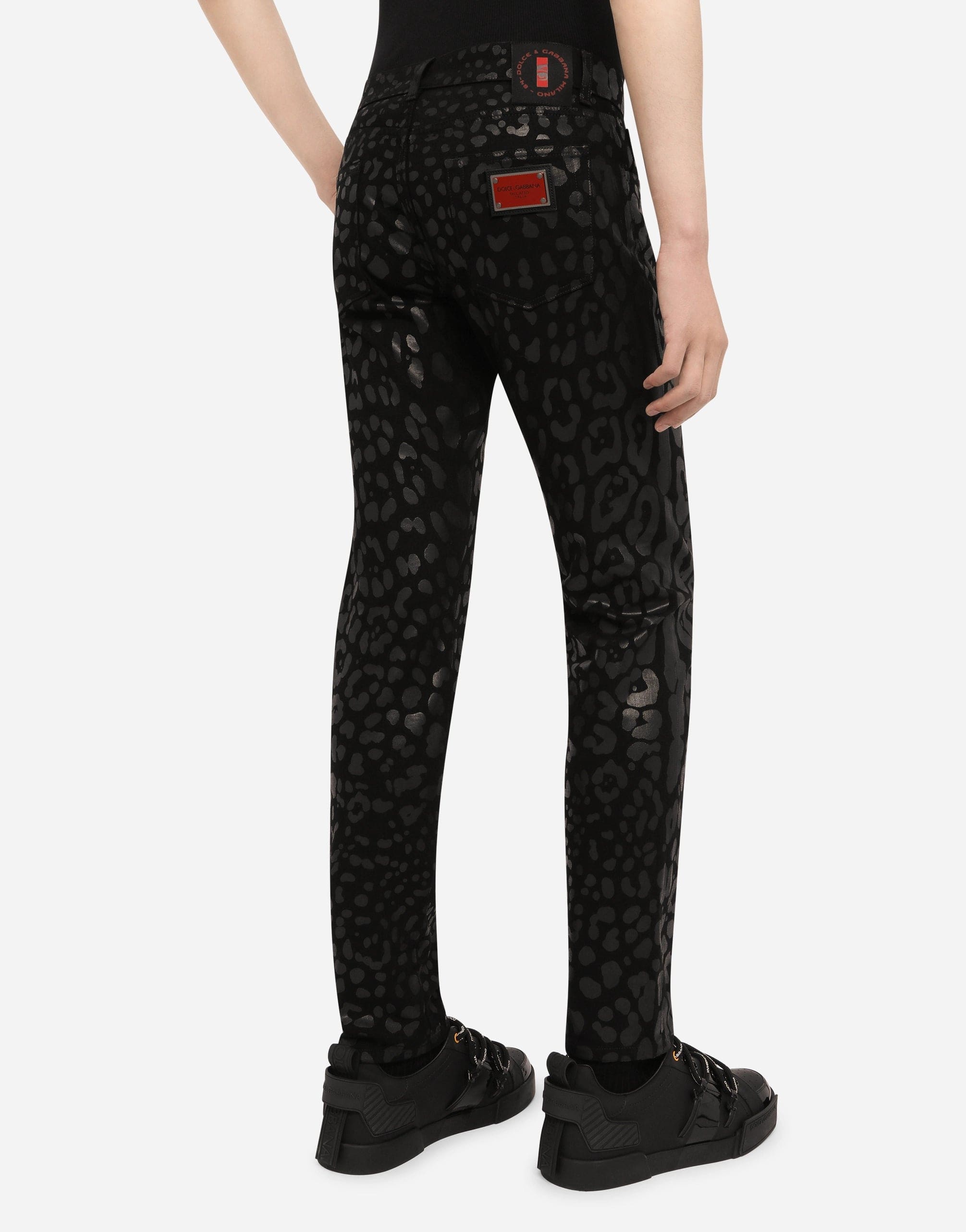Jeans slim fit floccati con stampa leopardata