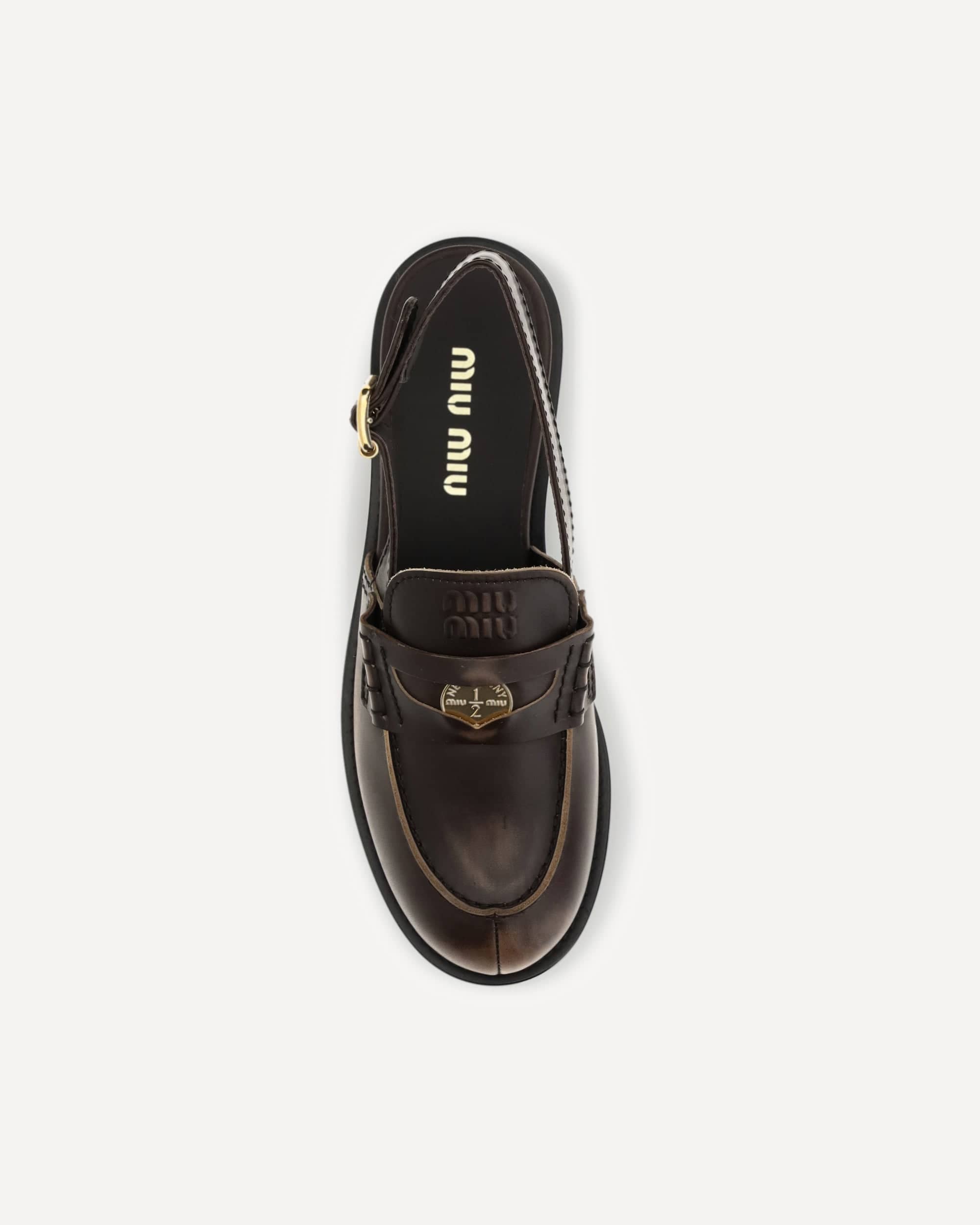 Miu Miu Buckled Leather Loafers
