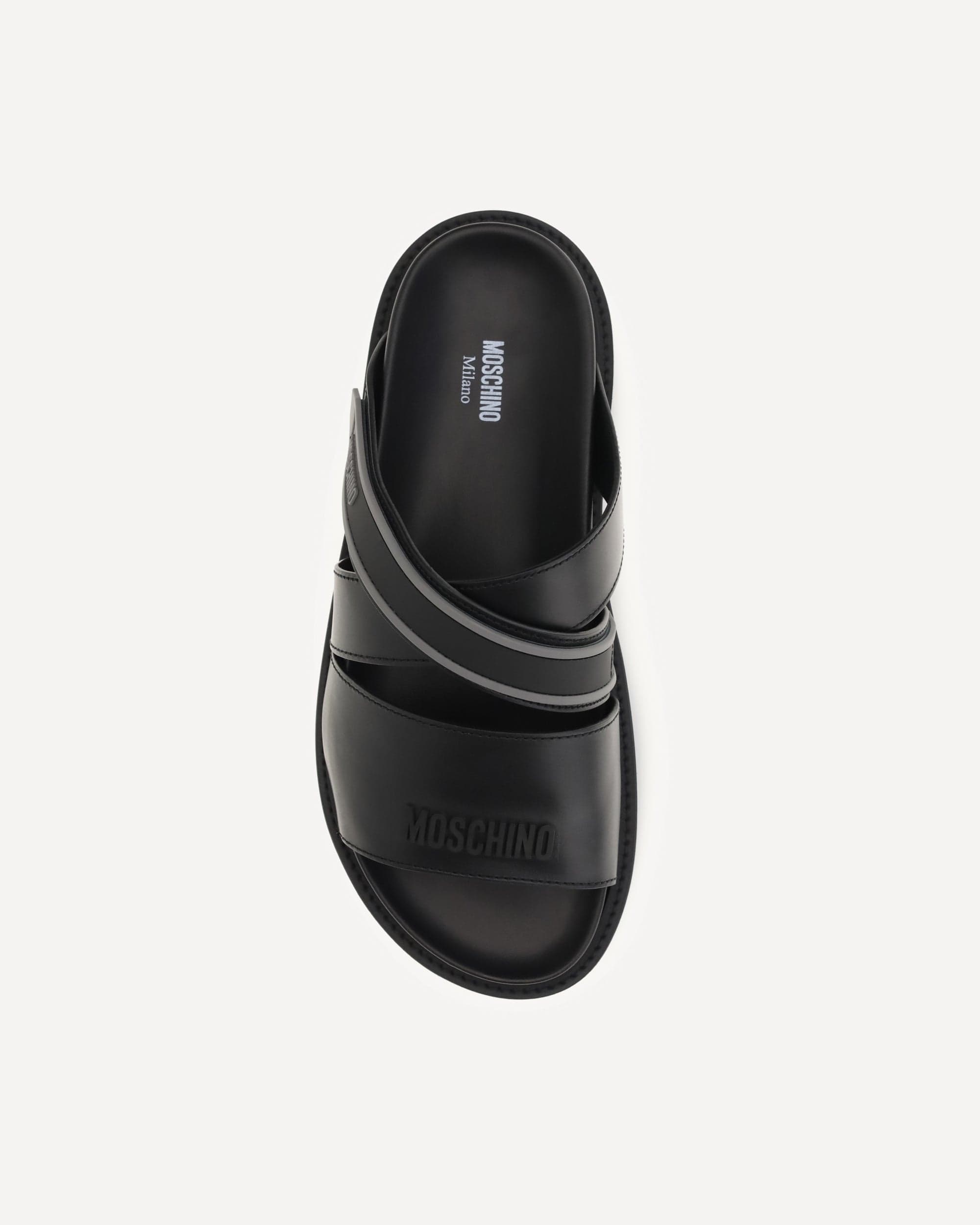 Moschino Flat Leather Sandals With Logo Weave